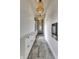 Hallway illuminated by pendant lighting, with built-in storage and stylish tile flooring at 8695 Morgan Dr, Fishers, IN 46038