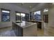 Modern kitchen with quartz countertops, island seating, and seamless transition to the outdoor patio at 8695 Morgan Dr, Fishers, IN 46038