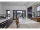 Bright kitchen featuring an expansive island, seating, and seamless access to outdoor living area at 8695 Morgan Dr, Fishers, IN 46038