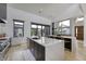 Spacious kitchen featuring a large island with a sink, modern appliances, and ample counter space at 8695 Morgan Dr, Fishers, IN 46038