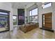 Bright living room featuring high ceilings, a modern fireplace, and views of the backyard at 8695 Morgan Dr, Fishers, IN 46038