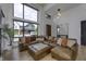 Bright living room with high ceilings, large windows, and an open floor plan to the front entry at 8695 Morgan Dr, Fishers, IN 46038
