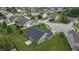 Brick home featuring a spacious, grassy backyard and patio, in a suburban neighborhood at 930 Penstock Ct, Avon, IN 46123