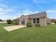 Backyard featuring a lush lawn, patio, and neatly trimmed landscaping at 930 Penstock Ct, Avon, IN 46123