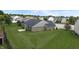 Brick home featuring a spacious, grassy backyard and patio, perfect for outdoor entertaining and leisure at 930 Penstock Ct, Avon, IN 46123