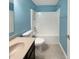 This full bathroom features a tub with shower, tile flooring, and modern fixtures at 930 Penstock Ct, Avon, IN 46123