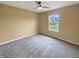 Neutral bedroom with carpeted floors, a ceiling fan, and a window for natural light at 930 Penstock Ct, Avon, IN 46123
