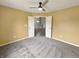 Cozy bedroom with carpet, ceiling fan, and direct access to the main living area at 930 Penstock Ct, Avon, IN 46123