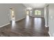 Open-concept living area with hardwood floors and views into other living spaces at 930 Penstock Ct, Avon, IN 46123