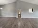 Open living room boasts a high ceiling and stylish flooring, creating a welcoming and spacious atmosphere at 930 Penstock Ct, Avon, IN 46123
