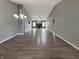 Spacious living room featuring hardwood floors, gray walls, and a cozy fireplace at 930 Penstock Ct, Avon, IN 46123