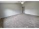 Spacious primary bedroom with a ceiling fan and plush carpet at 930 Penstock Ct, Avon, IN 46123