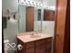 Well-lit bathroom with a vanity and mirror at 9451 S Amanda Dr, Claypool, IN 46510
