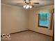 Bedroom with a carpet, window, and ceiling fan with overhead lighting at 9451 S Amanda Dr, Claypool, IN 46510