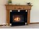 Close up of fireplace with black tile surround and decorative wood mantel at 9451 S Amanda Dr, Claypool, IN 46510
