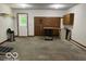 Garage with a concrete floor, pegboard, and door to the outside at 9451 S Amanda Dr, Claypool, IN 46510