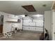 Spacious garage with shelving and a door leading to the outside at 9451 S Amanda Dr, Claypool, IN 46510