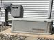 Exterior shot of a Generac backup generator installed on concrete pavers next to the house at 9451 S Amanda Dr, Claypool, IN 46510