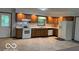 Traditional kitchen with wood cabinets, white appliances, and ample counter space at 9451 S Amanda Dr, Claypool, IN 46510
