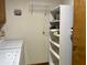 Laundry room with white shelving, a washer, and wire shelving at 9451 S Amanda Dr, Claypool, IN 46510