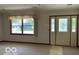 Bright living room with large windows and decorative glass doors at 9451 S Amanda Dr, Claypool, IN 46510