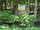 Sign marking Classified Wildlife Habitat on private property, surrounded by lush green vegetation at 9451 S Amanda Dr, Claypool, IN 46510