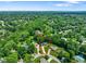 Aerial view showcasing the property with mature trees and neighboring houses at 955 Wood Creek Pl, Greenwood, IN 46142