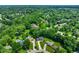 Aerial view of homes nestled among mature trees in a well-established neighborhood at 955 Wood Creek Pl, Greenwood, IN 46142