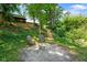 View of backyard firepit and walkway to the house at 955 Wood Creek Pl, Greenwood, IN 46142