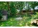 View of backyard firepit area, shed and house exterior at 955 Wood Creek Pl, Greenwood, IN 46142
