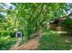 View of backyard shed, house, fire pit, and walkway at 955 Wood Creek Pl, Greenwood, IN 46142