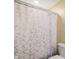 Bathroom features a pastel scale patterned shower curtain at 955 Wood Creek Pl, Greenwood, IN 46142