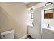Well-lit bathroom featuring a vanity, mirror, and a toilet at 955 Wood Creek Pl, Greenwood, IN 46142