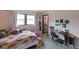 Bright bedroom featuring a window, closet, and desk area, perfect for a  at 955 Wood Creek Pl, Greenwood, IN 46142