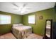 Cozy bedroom featuring a bed, windows, and a mirror at 955 Wood Creek Pl, Greenwood, IN 46142