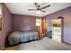 Bedroom featuring carpeted floors, ceiling fan and view of storage with shelving and books at 955 Wood Creek Pl, Greenwood, IN 46142