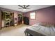 Spacious bedroom featuring two closets, carpeted floors, and soft purple walls at 955 Wood Creek Pl, Greenwood, IN 46142