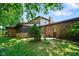 Exterior view of the rear of the home with mature landscaping at 955 Wood Creek Pl, Greenwood, IN 46142