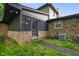 Back exterior with screened in porch, brick and vinyl siding at 955 Wood Creek Pl, Greenwood, IN 46142