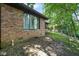Exterior view of brick home with large window and landscaping at 955 Wood Creek Pl, Greenwood, IN 46142