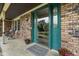 Charming front entrance featuring a decorative glass door, potted flowers, and a 'Welcome' mat at 955 Wood Creek Pl, Greenwood, IN 46142