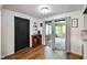 Mud room entry off eat-in kitchen with dark wood accents and access to patio at 955 Wood Creek Pl, Greenwood, IN 46142