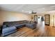 Comfortable living room with a large sectional sofa, hardwood floors, and stylish lighting at 955 Wood Creek Pl, Greenwood, IN 46142