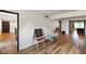 Open floor plan showcasing wood floors with two black easels in view at 955 Wood Creek Pl, Greenwood, IN 46142