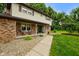 Close-up of front porch with decorative brickwork, seating area, and inviting walkway at 955 Wood Creek Pl, Greenwood, IN 46142
