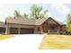 Craftsman-style home with a three-car garage, wood accents, brick details, and well-manicured lawn at 0 Legacy Estates Lot 2, Mooresville, IN 46158