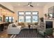 Bright living room with a fireplace, large windows, sectional sofa, and modern decor at 0 Legacy Estates Lot 2, Mooresville, IN 46158