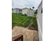 View of a well-kept backyard with a shed, and patio space, surrounded by grassy areas at 10129 Peartree Rd, Indianapolis, IN 46235