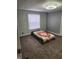Cozy bedroom with wood accent wall and neutral carpet at 10129 Peartree Rd, Indianapolis, IN 46235