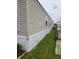 A cozy home with light siding and a manicured lawn creates a welcoming exterior at 10129 Peartree Rd, Indianapolis, IN 46235